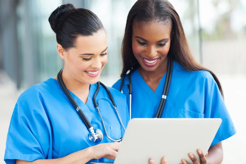 Two Horizons nurses reviewing a patient chart