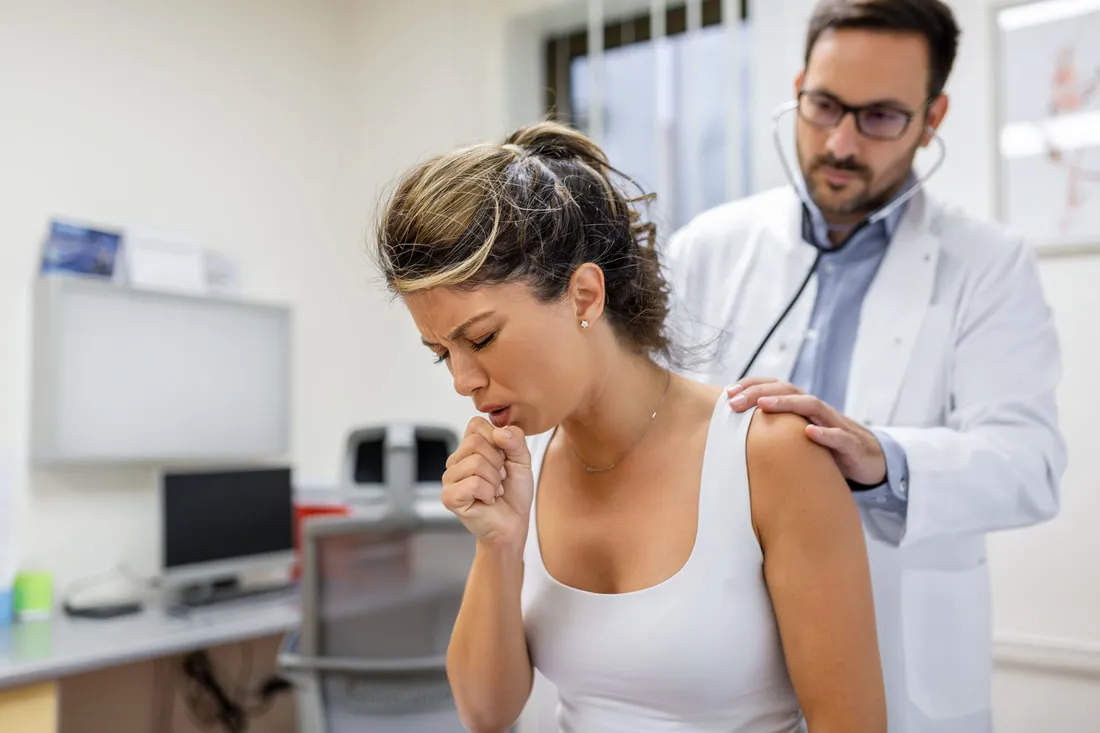 A provider listening to a patient&rsquo;s breathing
